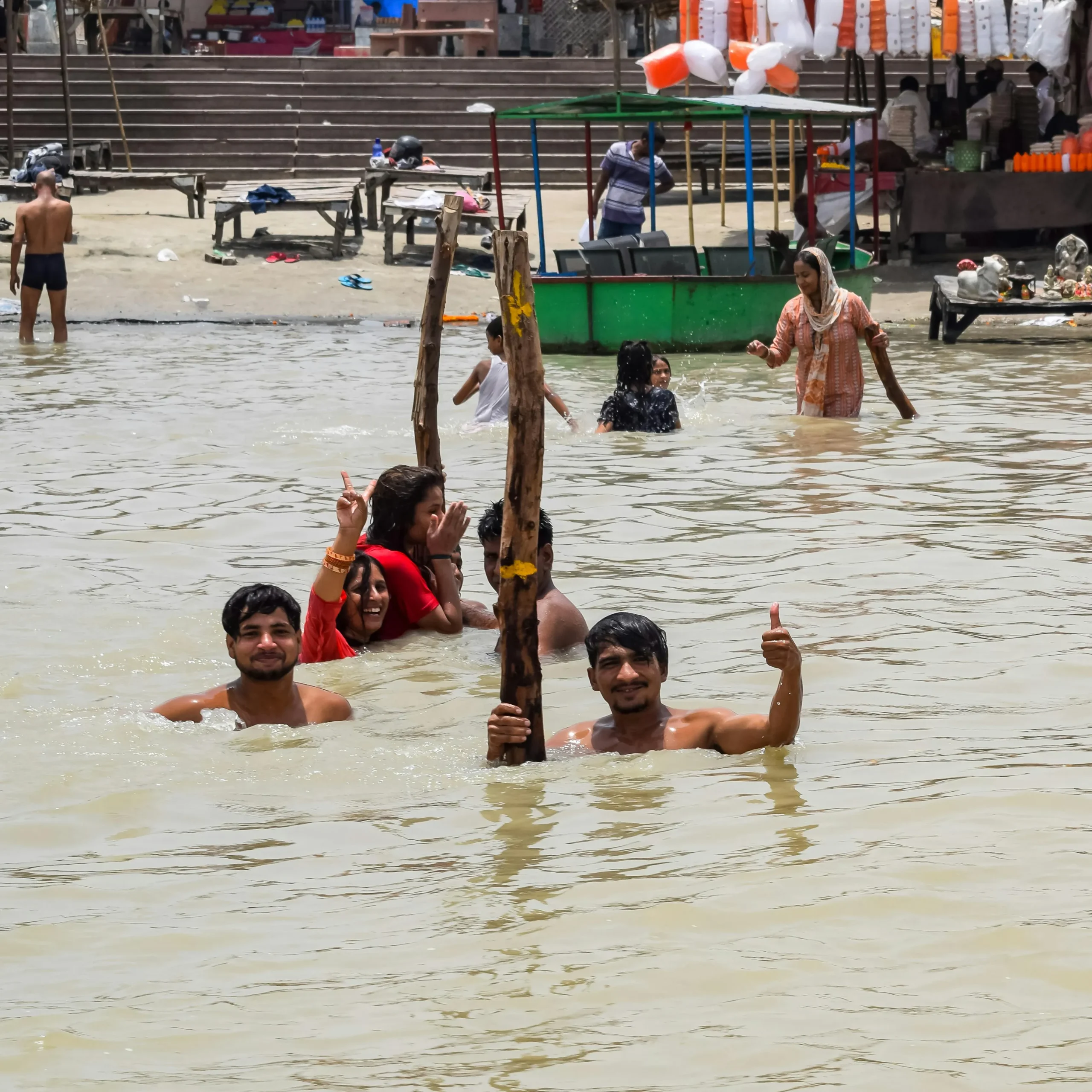 people taking holy dips in ganga ghats